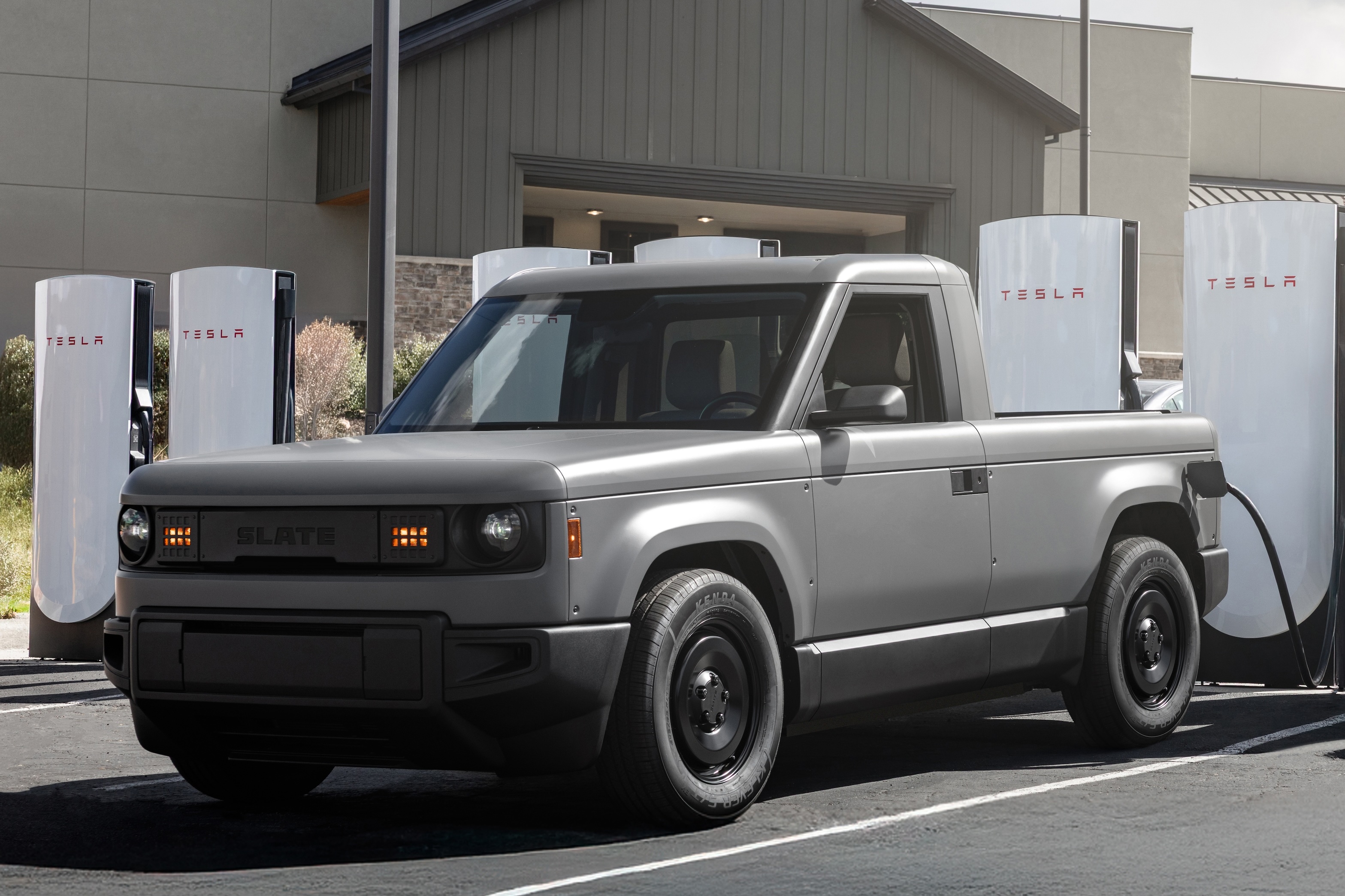 Slate Auto's Blank Slate truck charging at a Tesla Supercharger