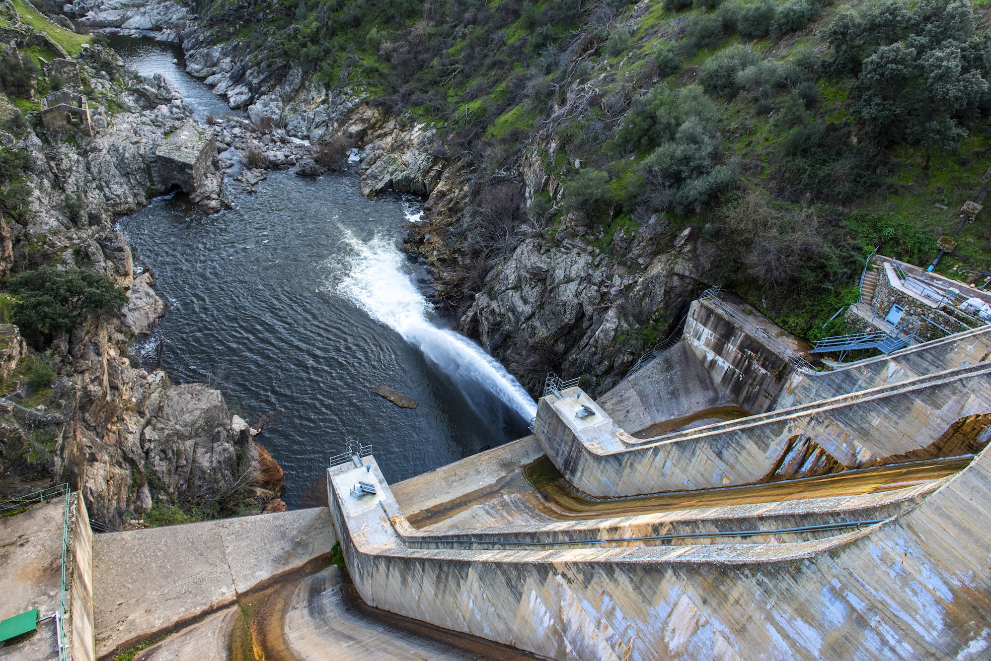 a photo of a dam in Spain seen spilling water.