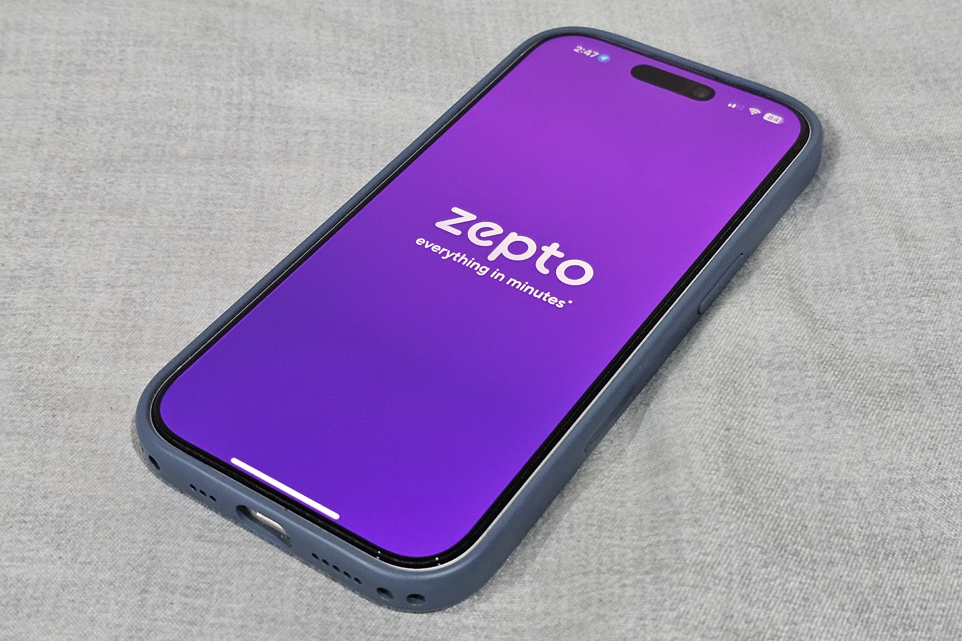 Zepto logo on smartphone